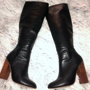 Black boots, brown heel.